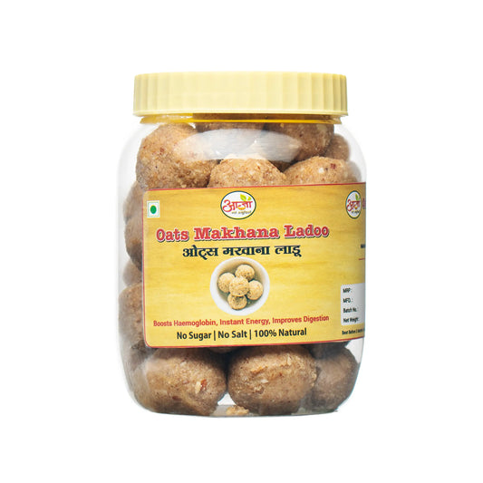 Oats Makhana Ladoo comes in a clear plastic jar with a yellow lid. The label shows the ladoos on a yellow background and highlights “No Sugar | No Salt | 100% Natural”—a healthy, protein-rich snack. - Oats Makhana Ladoo - My Store